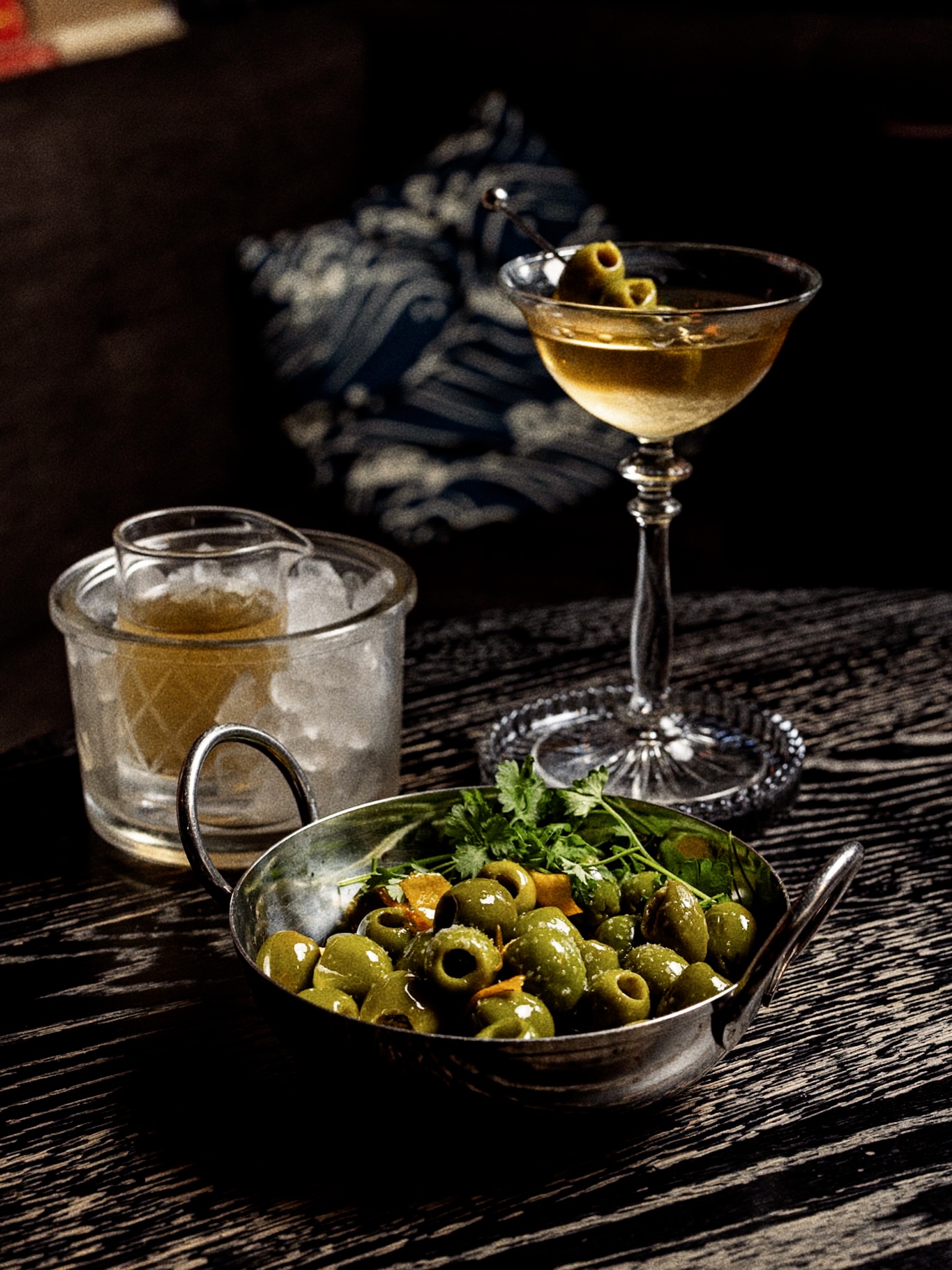 Our Marinated Olives feature Castelvetrano olives infused with garlic, fresh herbs, olive oil, and bright citrus notes — a simple indulgence, thoughtfully prepared. Pair them with a perfectly crafted cocktail and make your next evening at Room 56 a little more memorable. Discover your new favorite pairing. Reserve your table through the link in our bio. 🥂